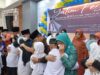 Momen haru dalam acara berbagi keberkahan bersama 500 anak yatim saat Bupati Agam gendong anak yatim