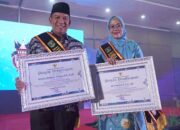 Pj Wako dan Pj Ketua TP-PKK Padang Panjang Terima Anugerah Ayah dan Bunda GenRe Pengayom