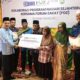 Kemenag Sawahlunto bersama FOZ, Salurkan Bantuan 250 Karung Beras untuk Kampung Zakat Lumindai