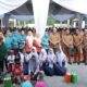 Bupati Asahan saat penyerahan BPJS Kesehatan gratis kepada masyarakat di halaman kantor Camat Kisaran Barat