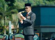 Bupati Solok Selatan, H. Khairunas saat membacakan amanat Menteri Dalam Negeri dalam upacara peringatan Hari Otonomi Daerah ke-30 Tahun 2026